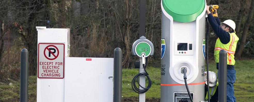 technician fixing charging station